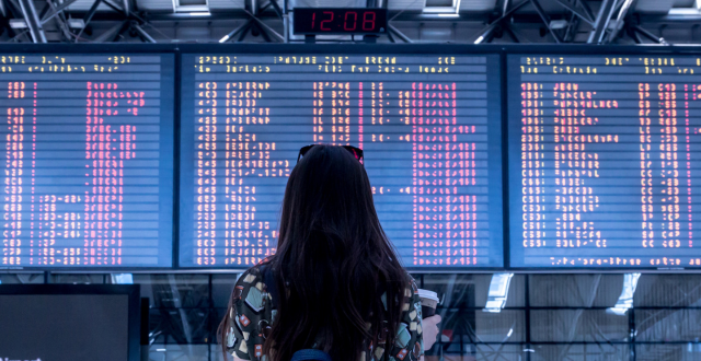 Woman looking at boarding status 