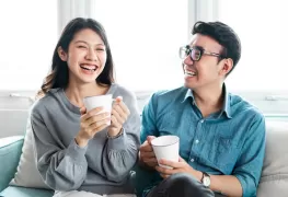 Couple on sofa with coffee